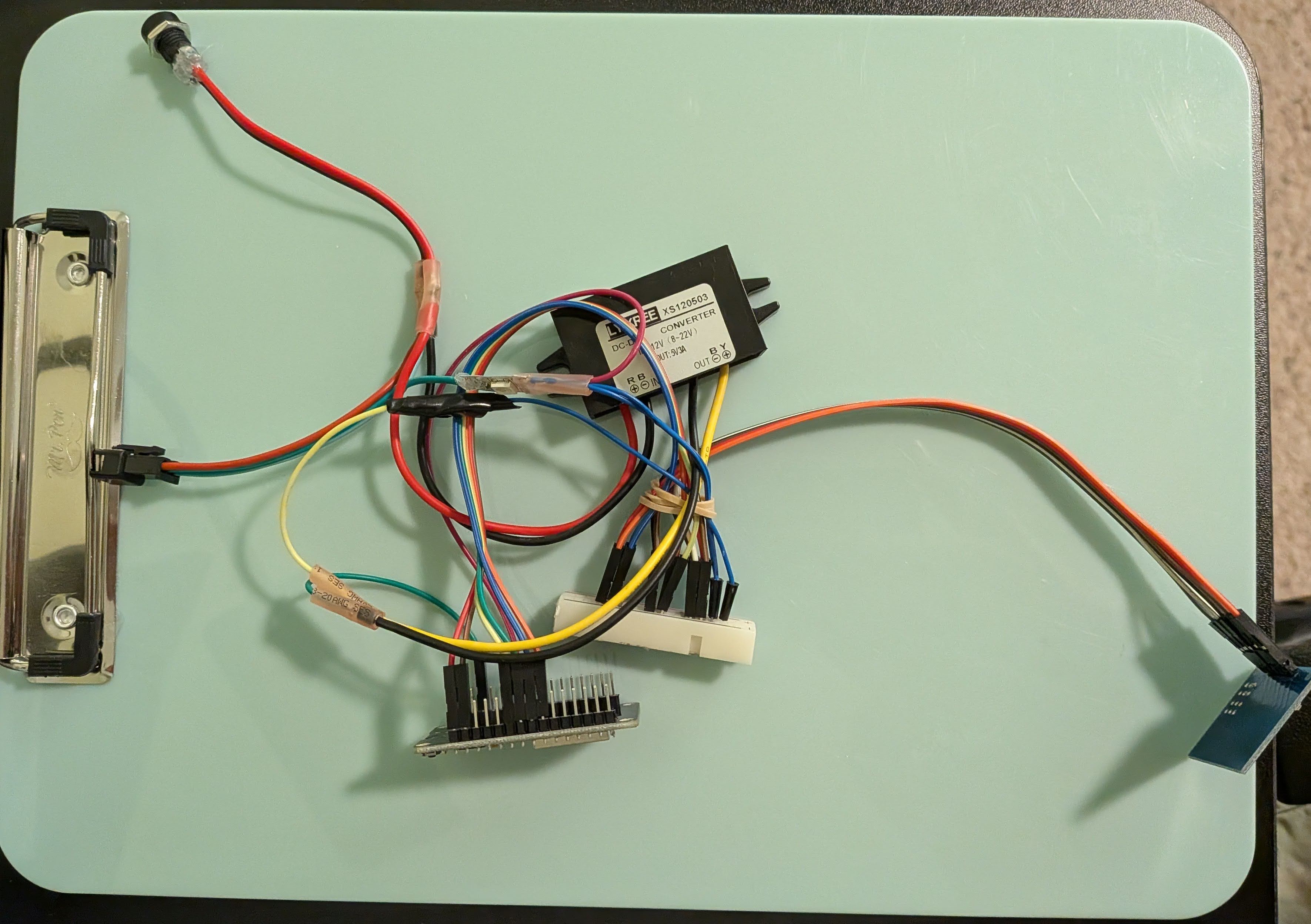 Various electronic components with wires stretching between them, connected by heatshrink or physical jumper connections